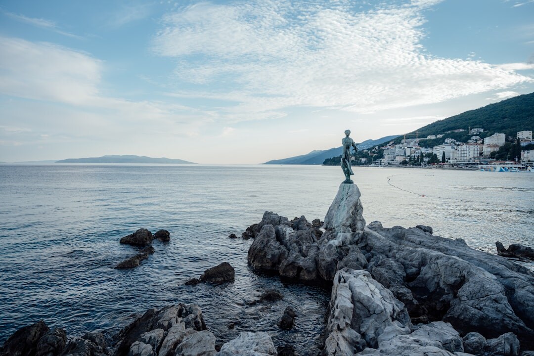 Portrait of a weathered Croatian fisherman on his boat at dawn